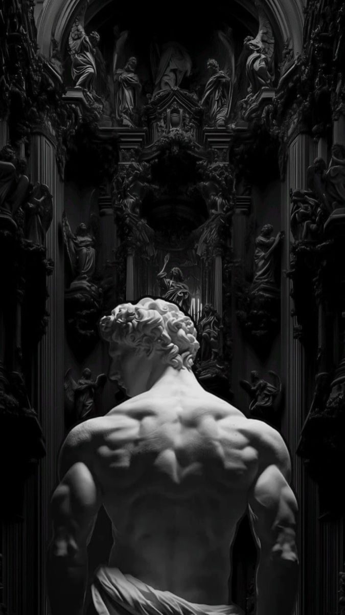 Marble statue seen from behind, sculpted back muscles in a dark hall